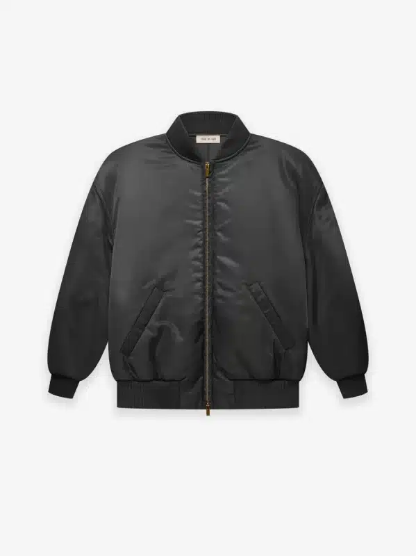 The Nylon Twill Bomber, featuring a black design with a gold zipper, front pockets, and ribbed cuffs and hem, is showcased against a white background.