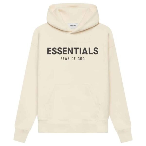 The Fear of God Essentials Oversized Hoodie 'Butter-Cream' showcases a cream-colored design with bold black ESSENTIALS text and FEAR OF GOD subtly printed beneath it. It includes a front pocket and a drawstring hood.