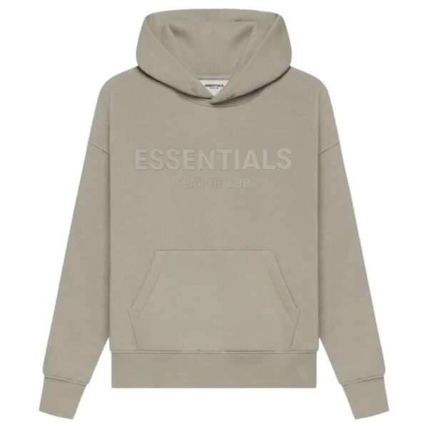 The Fear of God Essentials Pullover Hoodie 'Core-Heather' is a beige hoodie featuring ESSENTIALS and FEAR OF GOD embroidered on the front. It includes a front pocket and a hood, displayed against a plain white background.