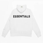 A white Fear Of God Essentials Reflective Letter Hoodie featuring large black letters spelling out ESSENTIALS across the back.