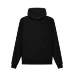 The Fear of God Essentials FG7C Hoodie 'Black' showcases a high collar and long sleeves. This plain black hoodie is accented with ribbed cuffs and hem, and it includes a small design or logo on the lower sleeve. The hood is up, adding to the sleek look against a plain white background.