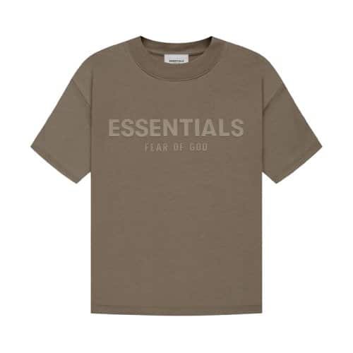 The Fear of God Essentials T-Shirt 'Harvest' is a khaki-colored tee featuring the words ESSENTIALS and FEAR OF GOD printed on the front in a subtly darker shade. It boasts a simple, classic design with short sleeves.